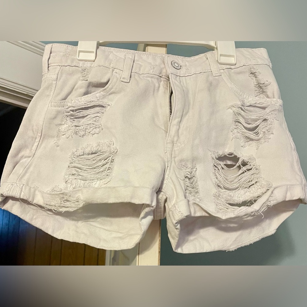 White ripped shorts